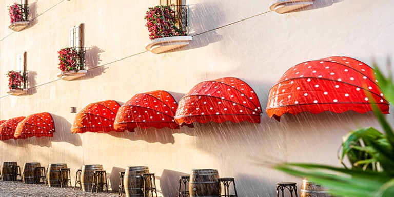 Climate-controlled raining street experience at The Heart of Europe Dubai