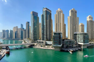 Dubai Marina waterfront with sea-view apartment towers and yachts